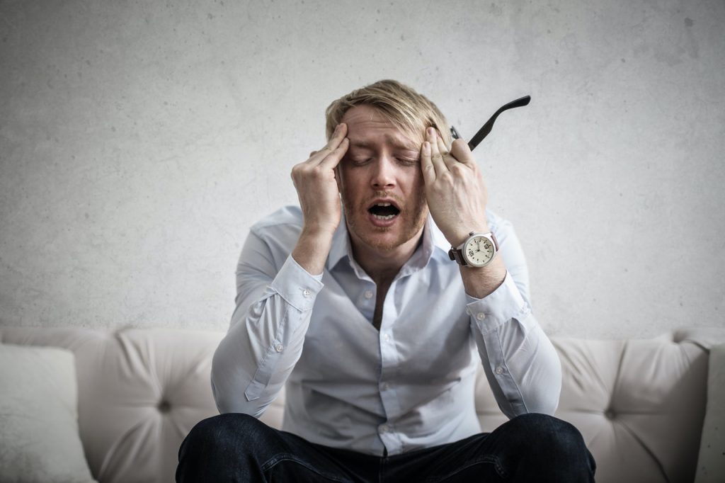 man stressed in pain tinnitus guide