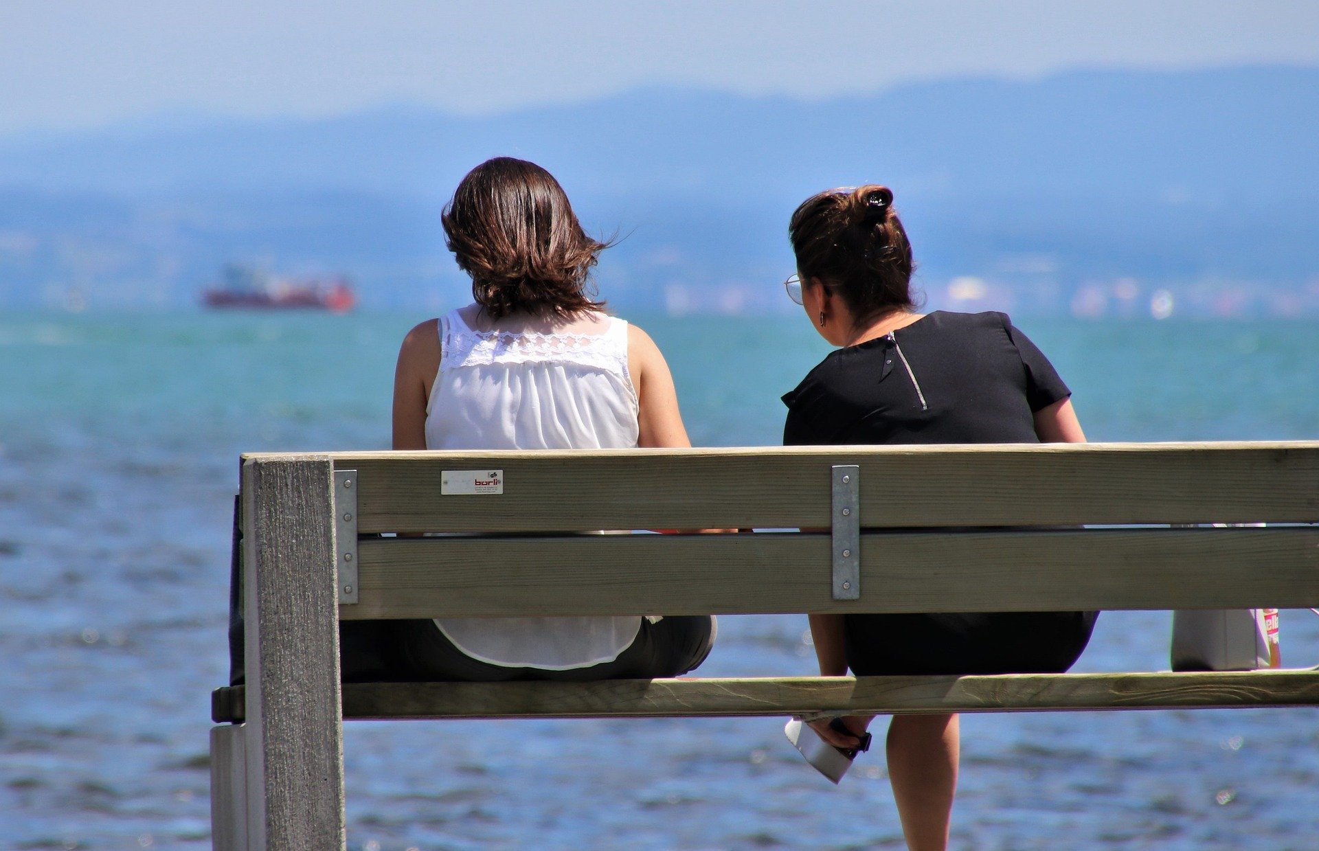 two people on a bench hidden hearing loss