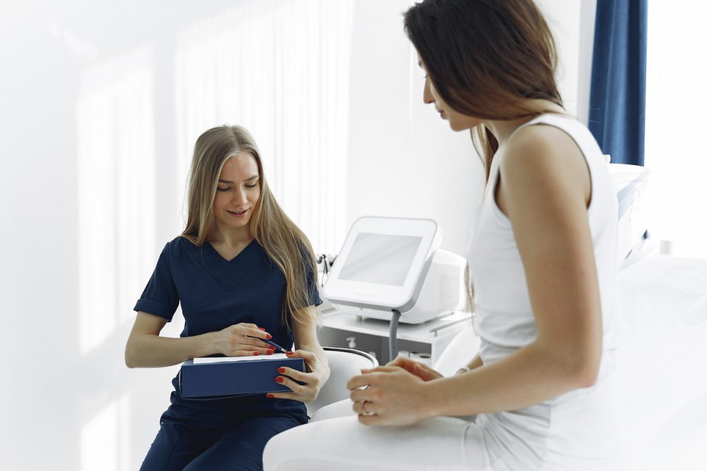 woman talking to doctor unilateral hearing loss treatment