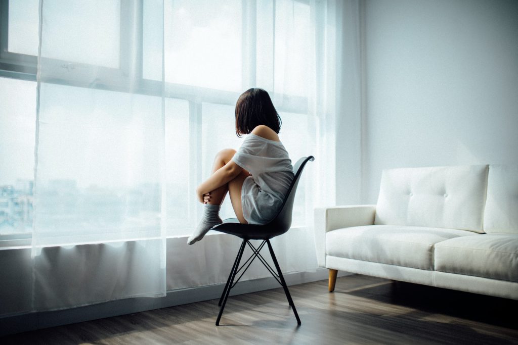 woman sitting alone Meniere's disease