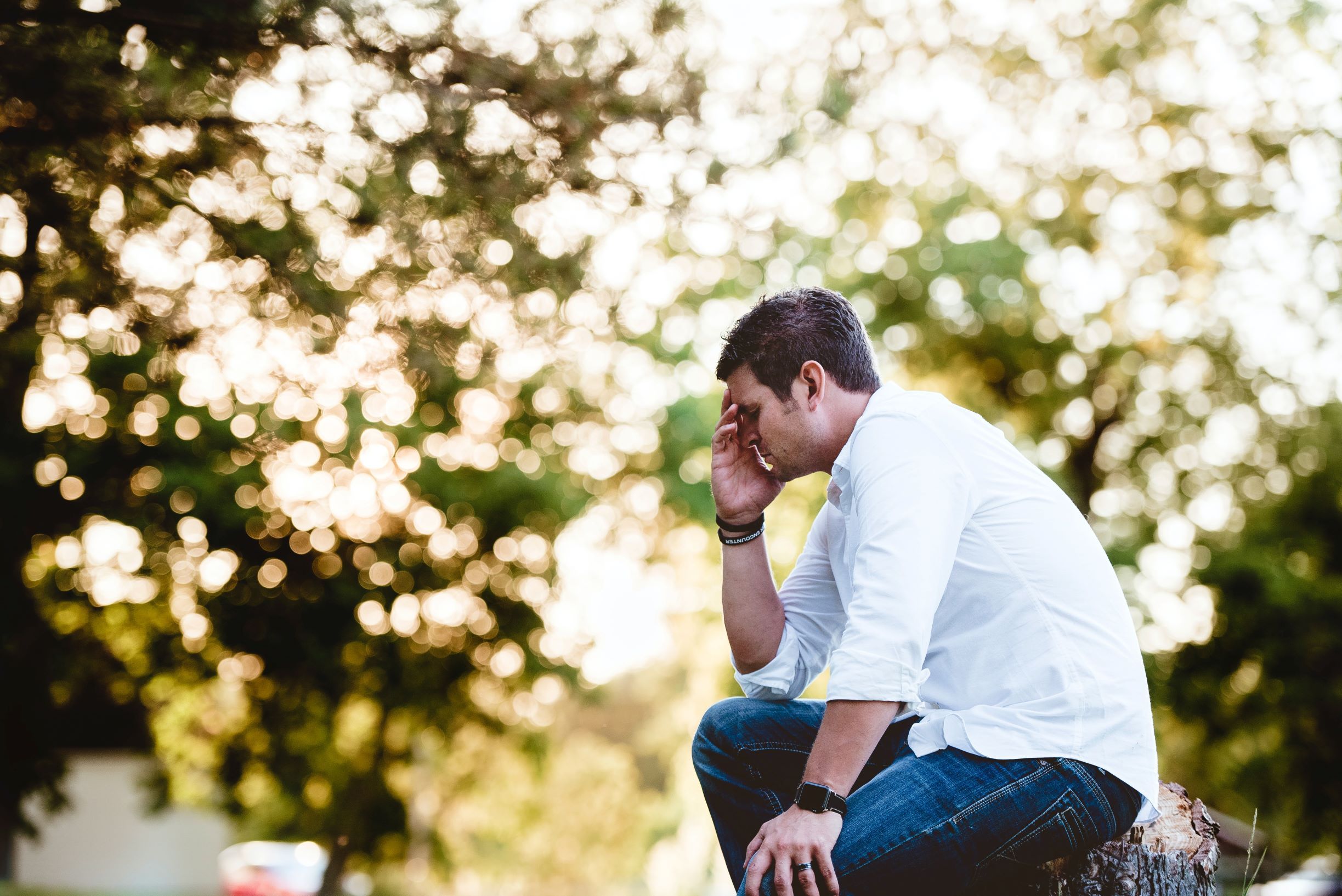 man in pain over conductive hearing loss