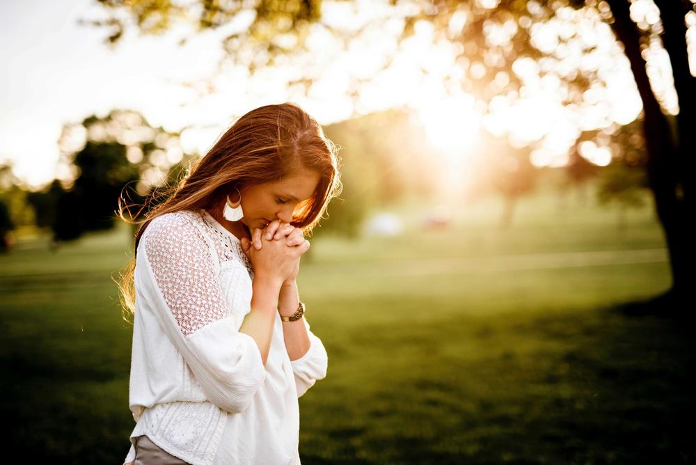 Woman Praying For Tinnitus To Go Away - Tinnitus Types And Causes