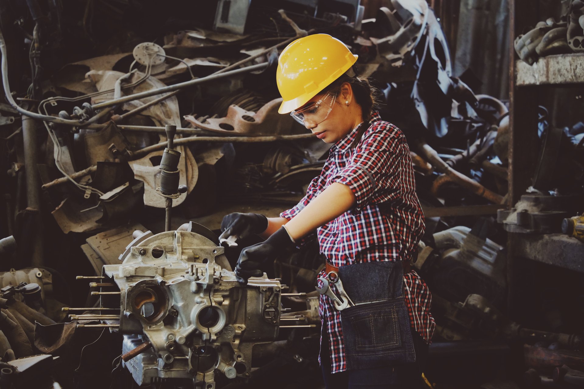 woman working yellow hardhat hearing loss at work