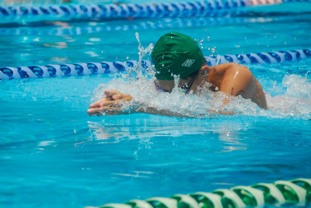 man swimming swimmer ear ear infection muffled hearing