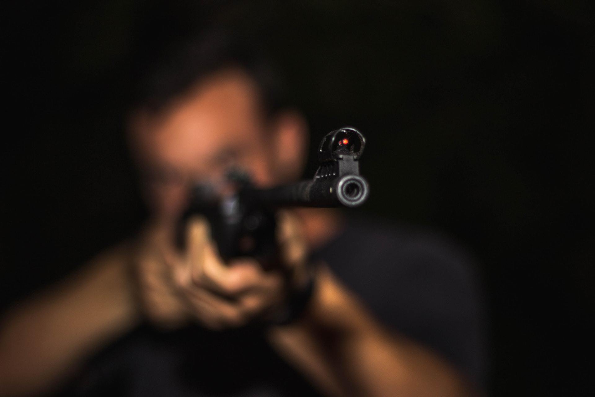 Man Shooting Gun No Hearing Protection best earplugs for shooting