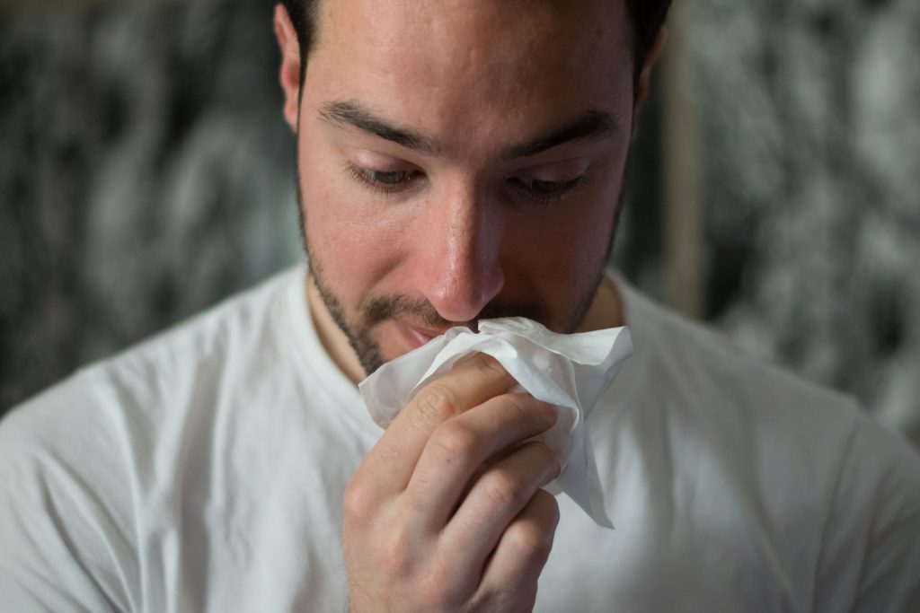 man with congestion clogged ears medicine