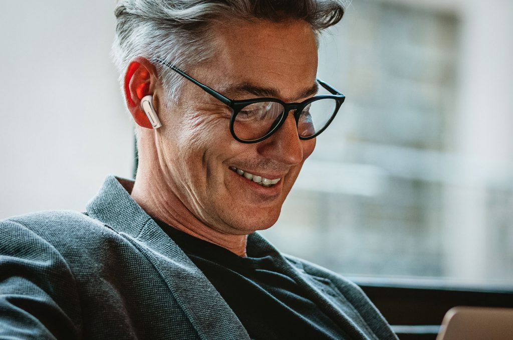 man with glasses wearing Olive Pro