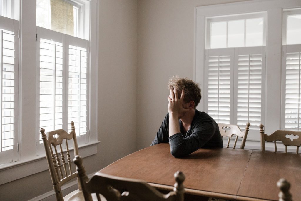 dejected man burden of hearing loss family hearing loss