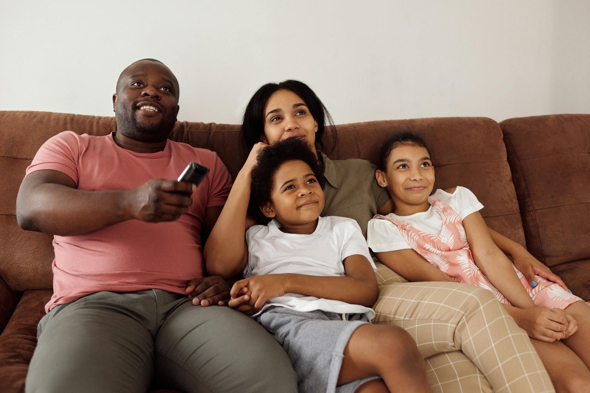 Family Watching TV Together TV Amplification Device