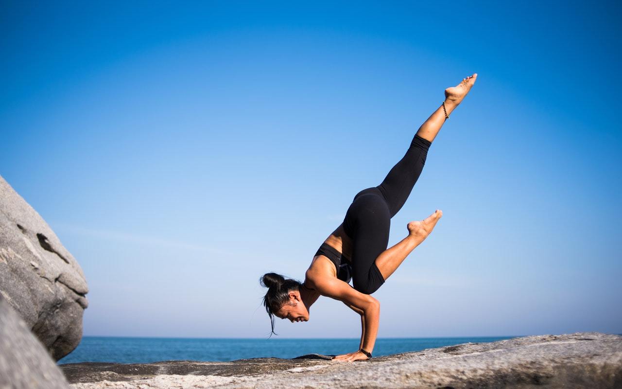 woman doing yoga what you can do for healthy hearing