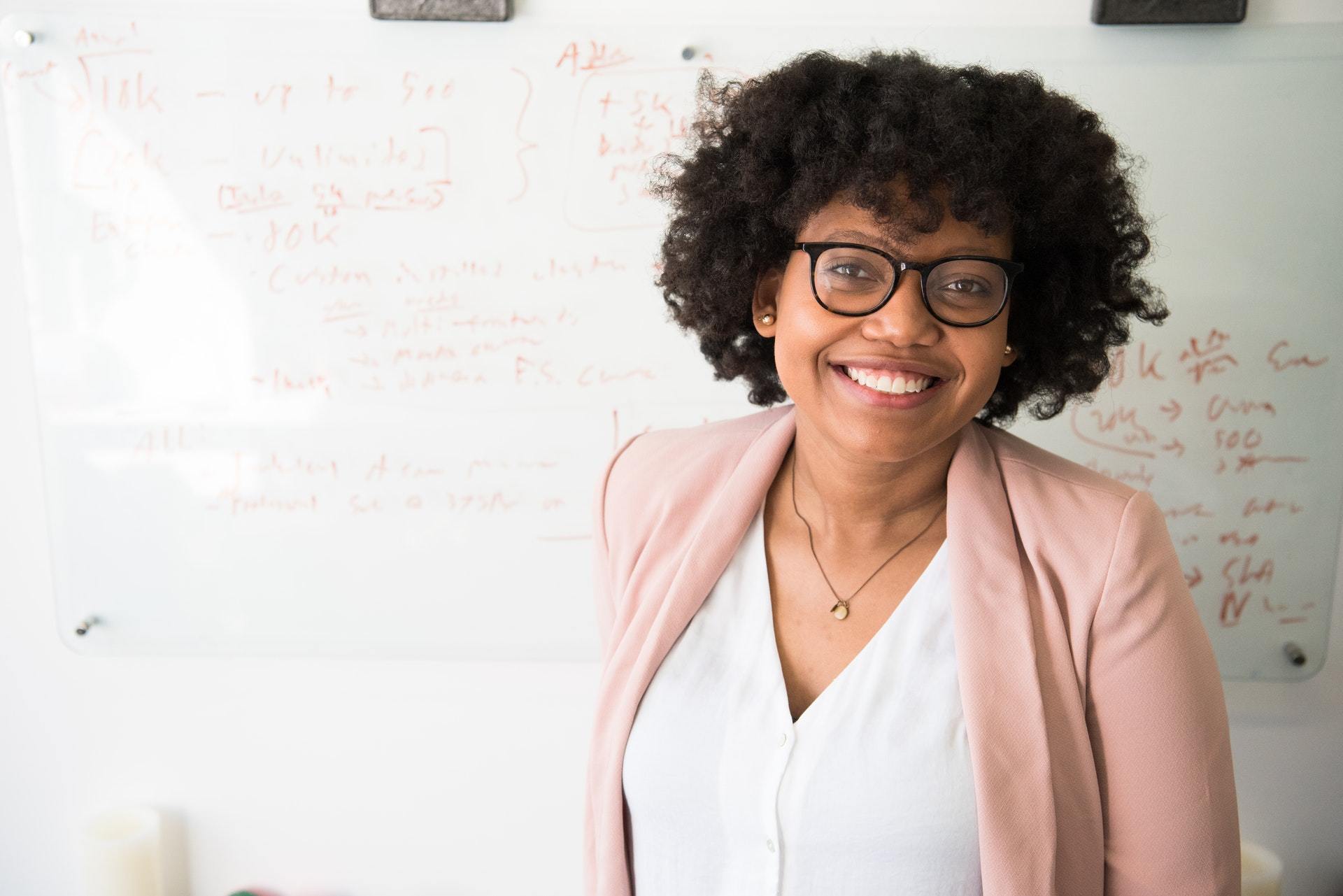 woman smiling happily openfit hearing aids