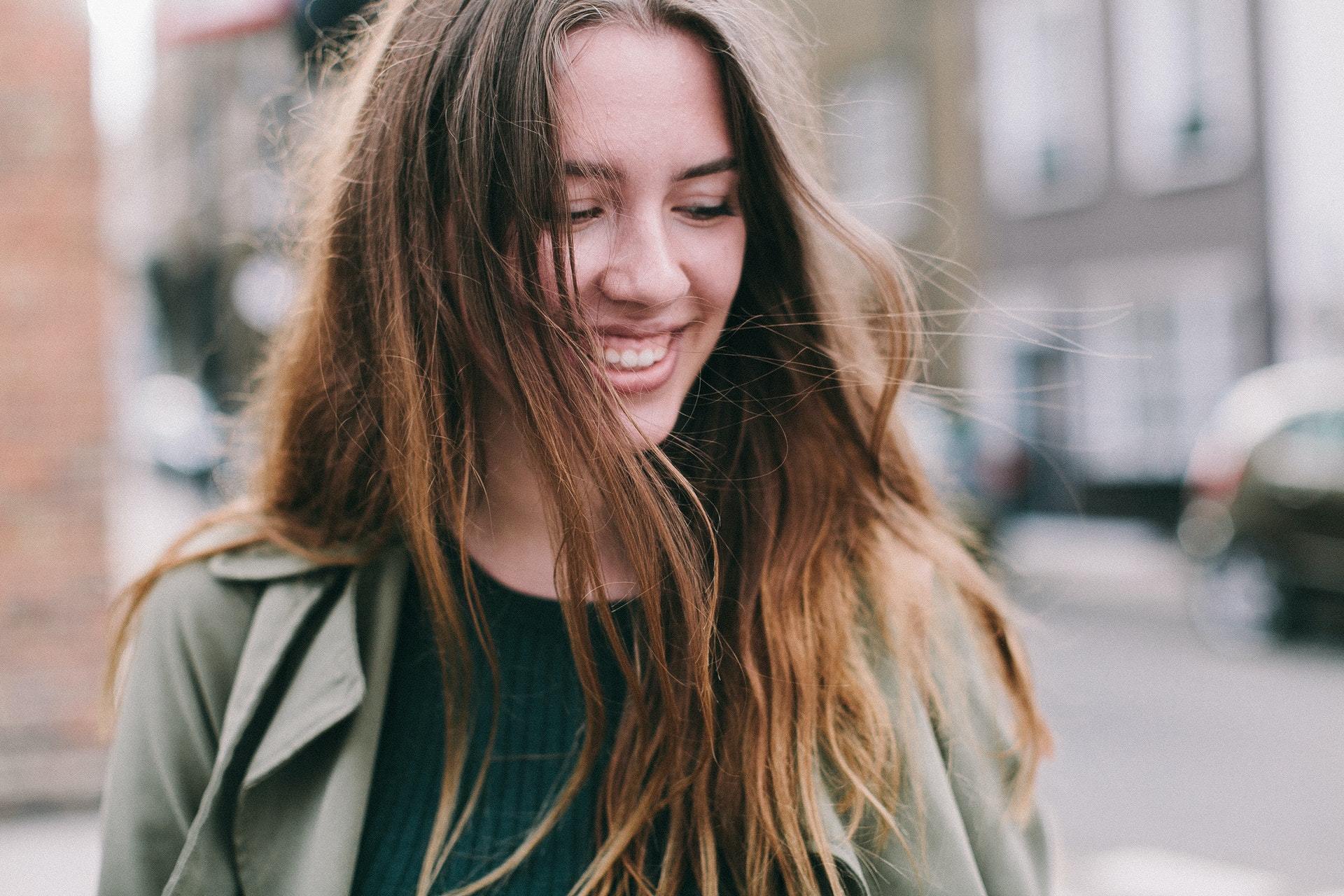 woman smiling earmolds for hearing aids