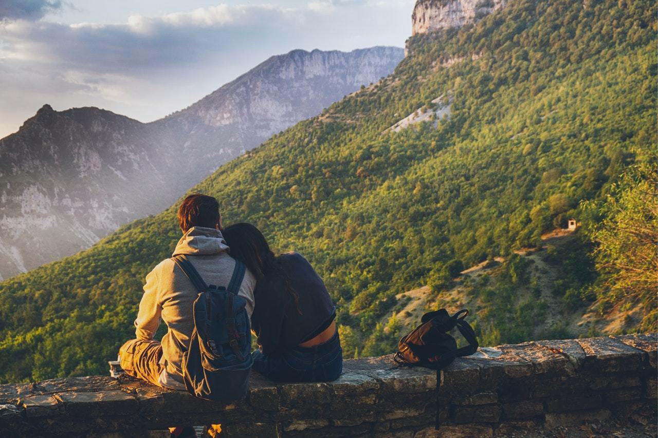 Couple looking at mountain hearing aids long life