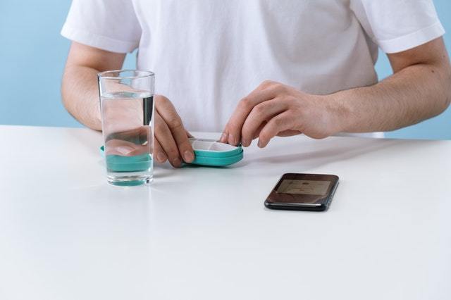 Man With Water Hearing Aid Case