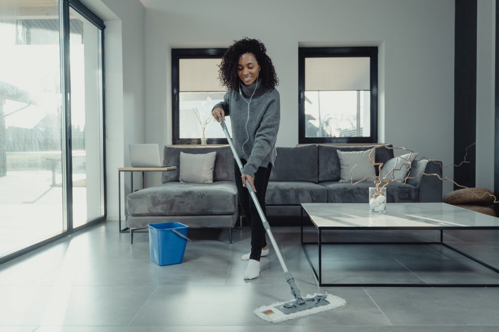 woman vacuuming room age hearing protection