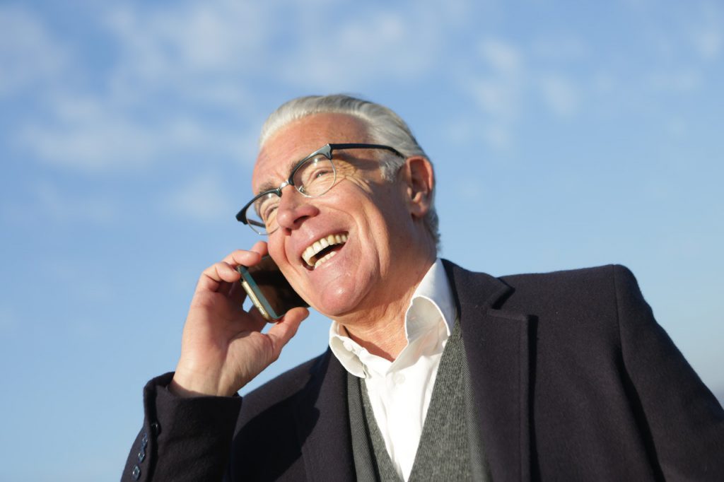 Man Talking on Phone ITE Hearing Aids